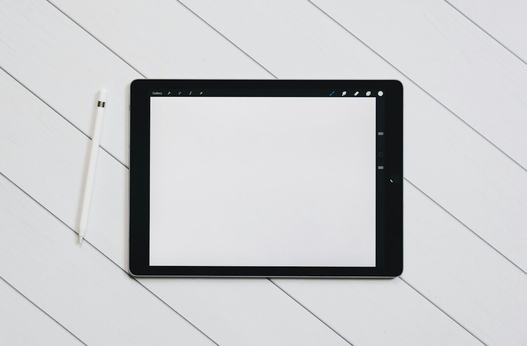 Tablet showing an action plan checklist on a desk