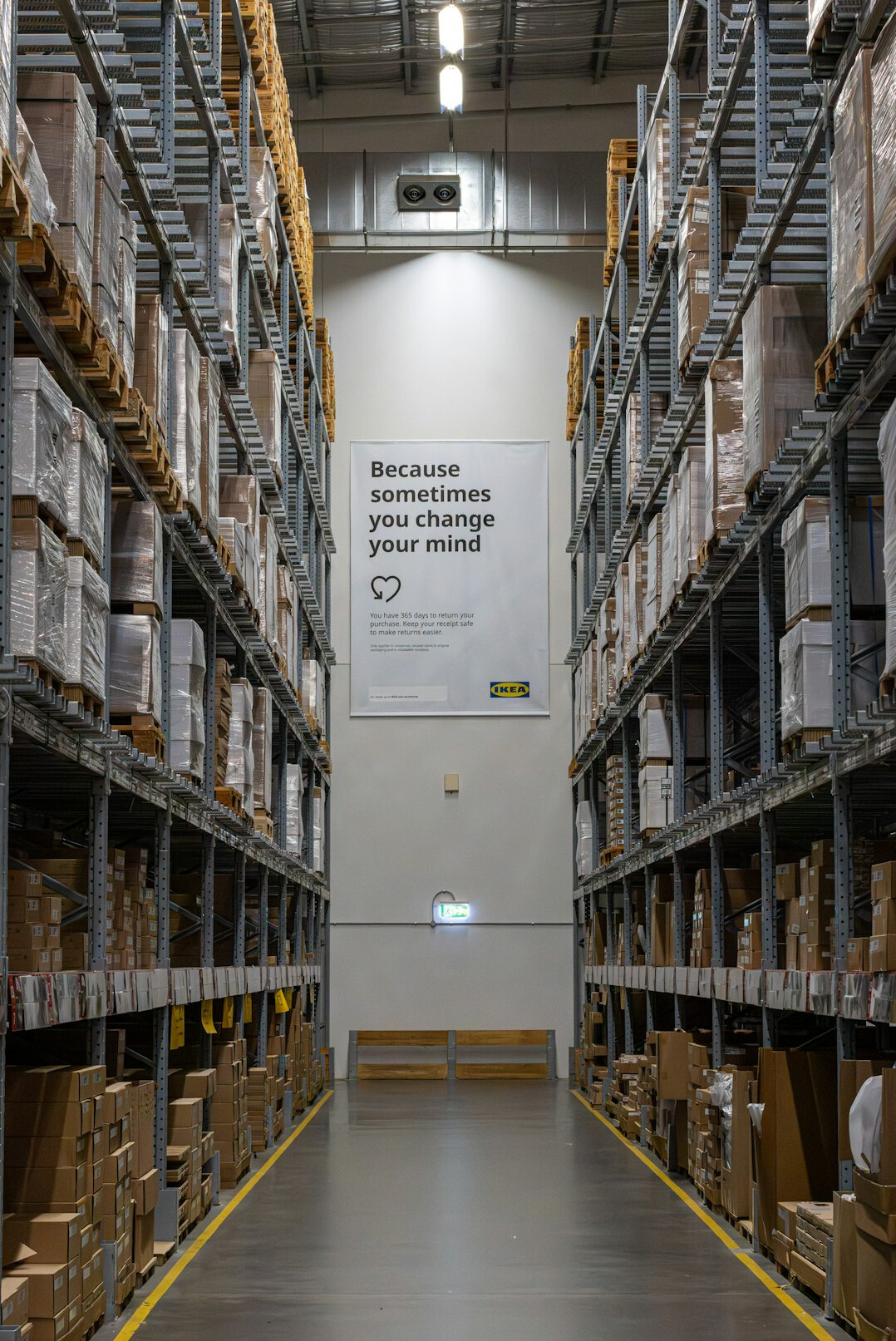 Warehouse aisle with shelves full of boxes